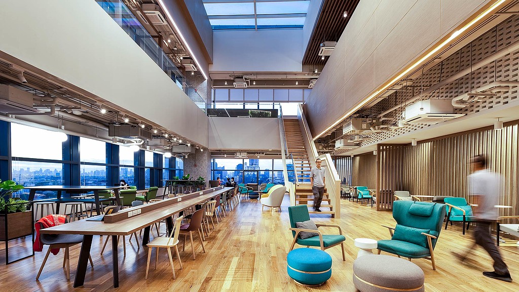 A room with tables and chairs.